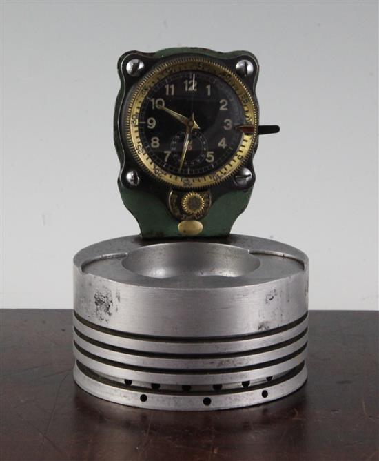 A Messerschmitt cockpit timepiece, numbered 30600, mounted on a piston head, 5.25in.